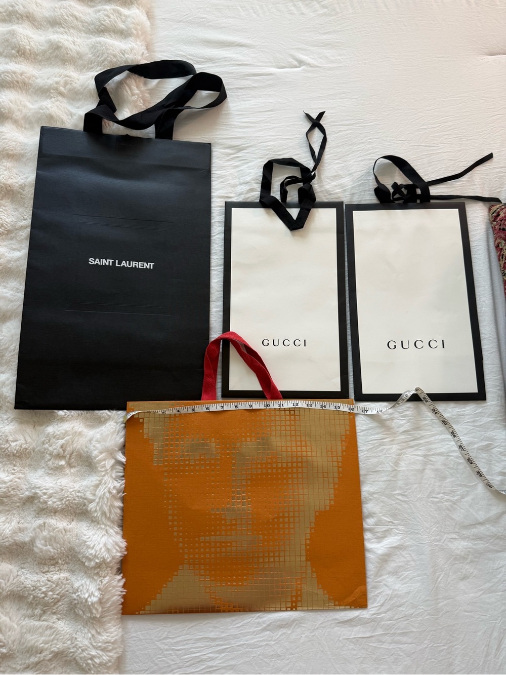 Lot of Designer gift bags: LV limited edition, two Gucci and one YSL